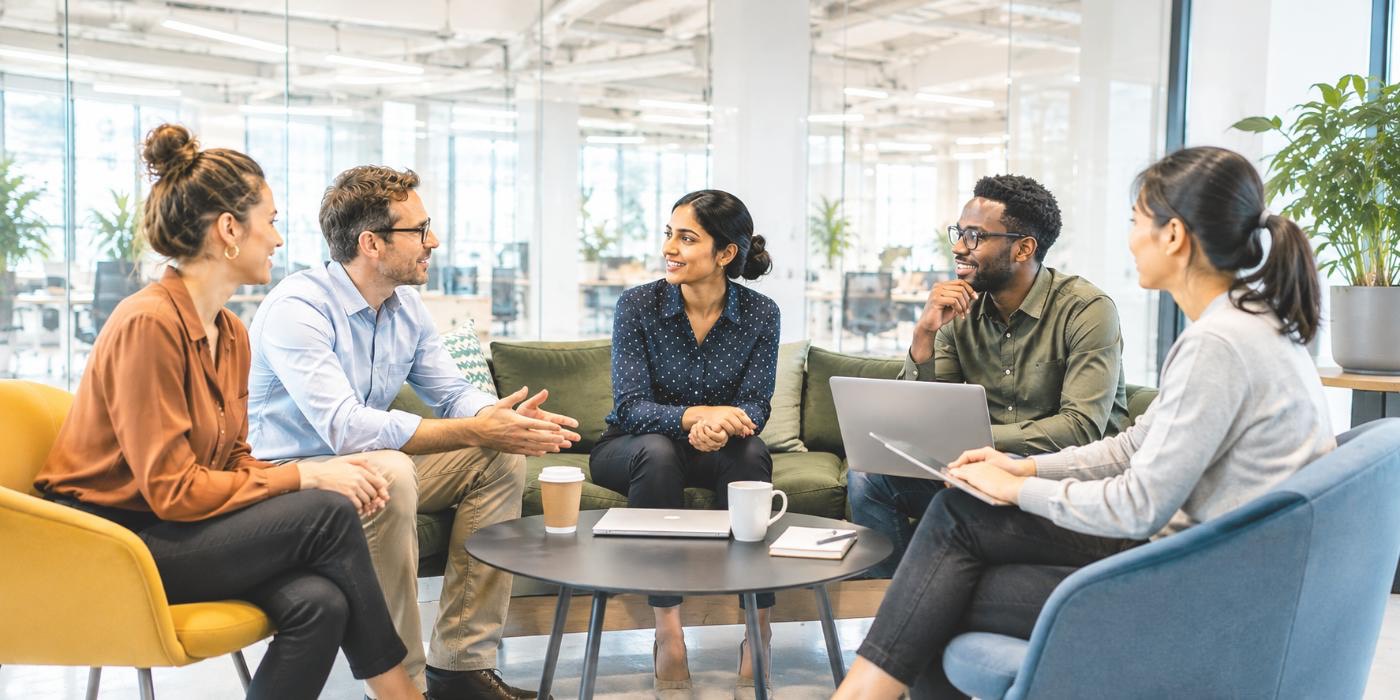 Team in conversation in an open office